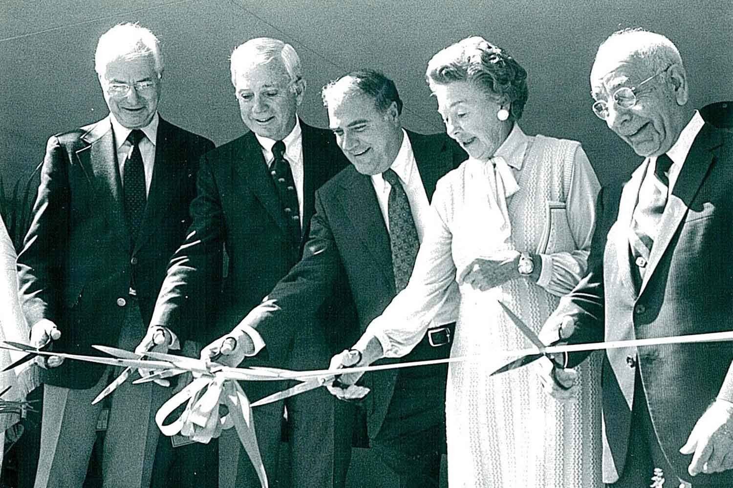 A group of represenatives cut a ribbon to inaugrate the opening of U C S F offices at the Fresno VA in 1981.